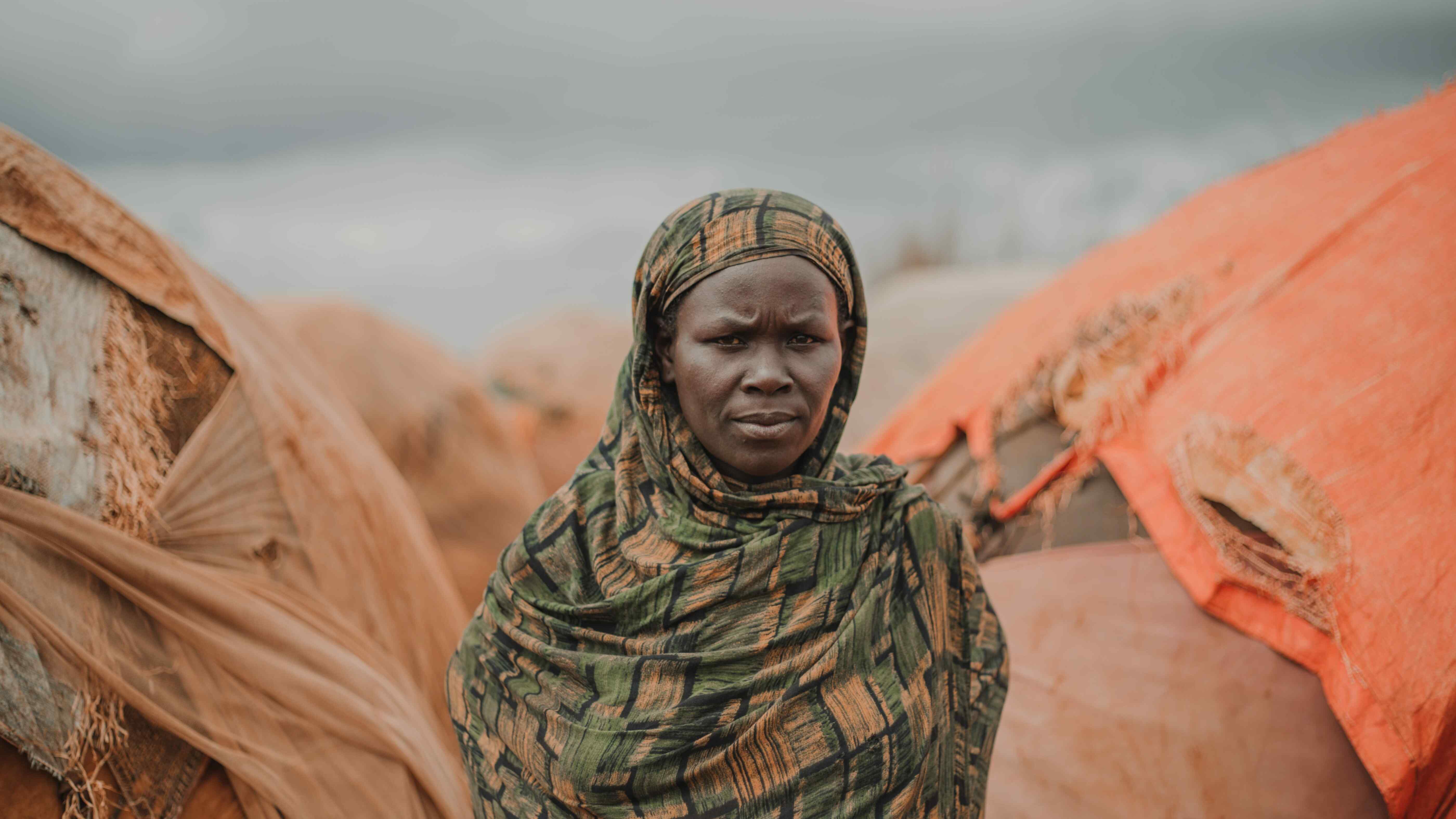 A woman poses for a photo outside in Somalia.