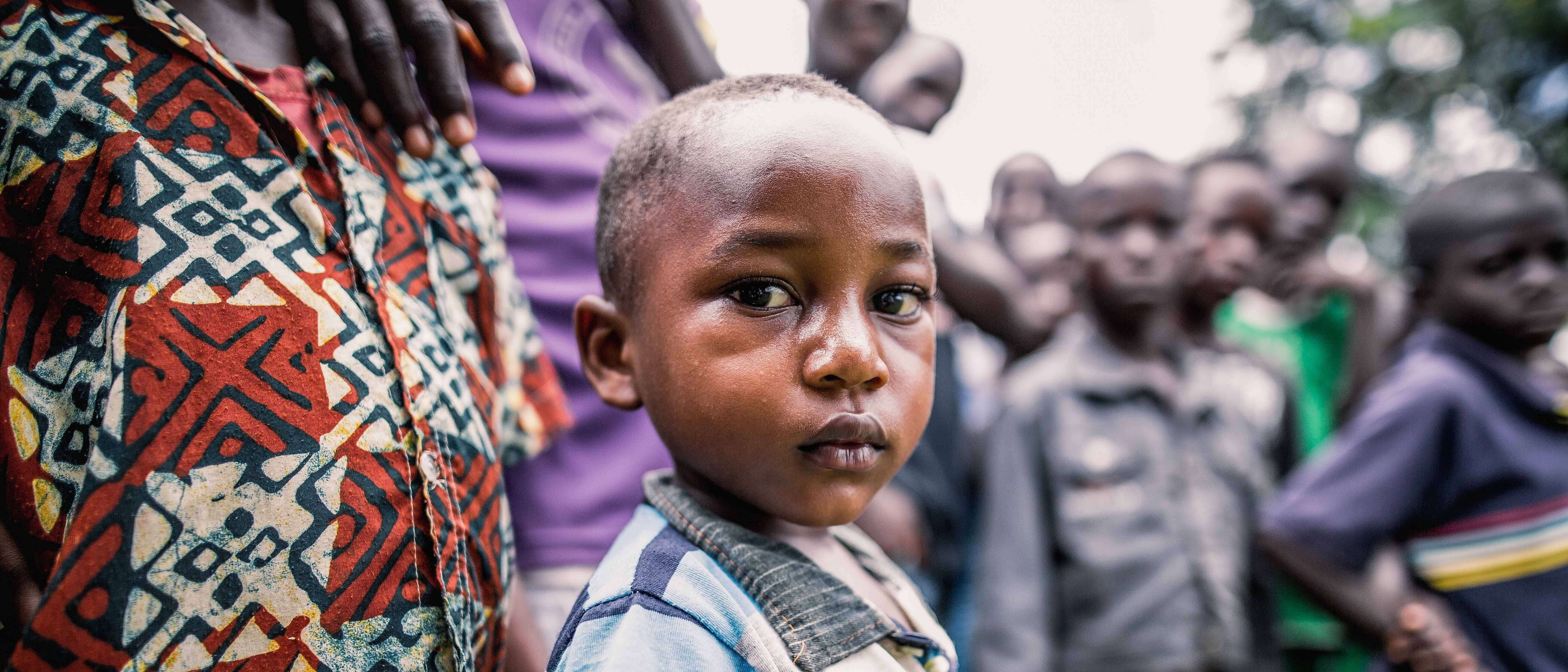 A young boy poses for a photo.